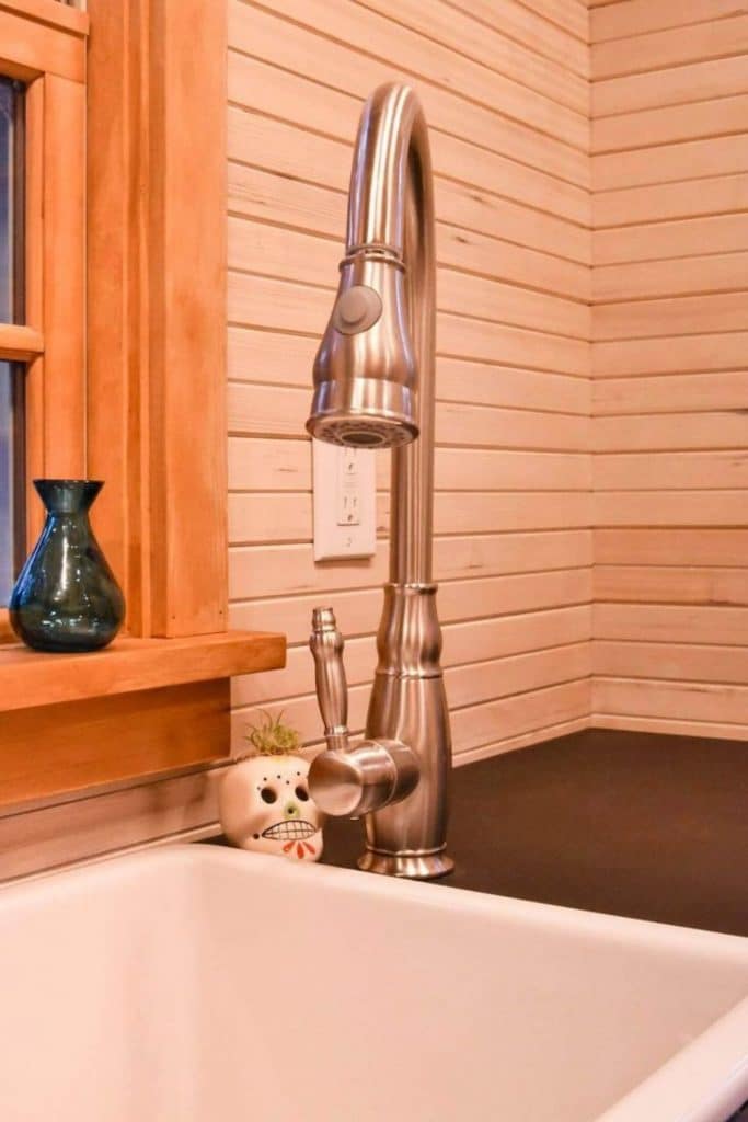 Close up of stainless steel faucet at kitchen sink