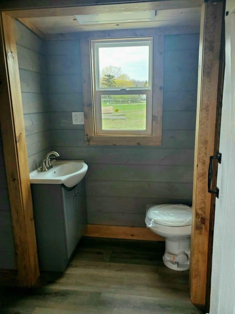 View into bathroom with sink across from toilet