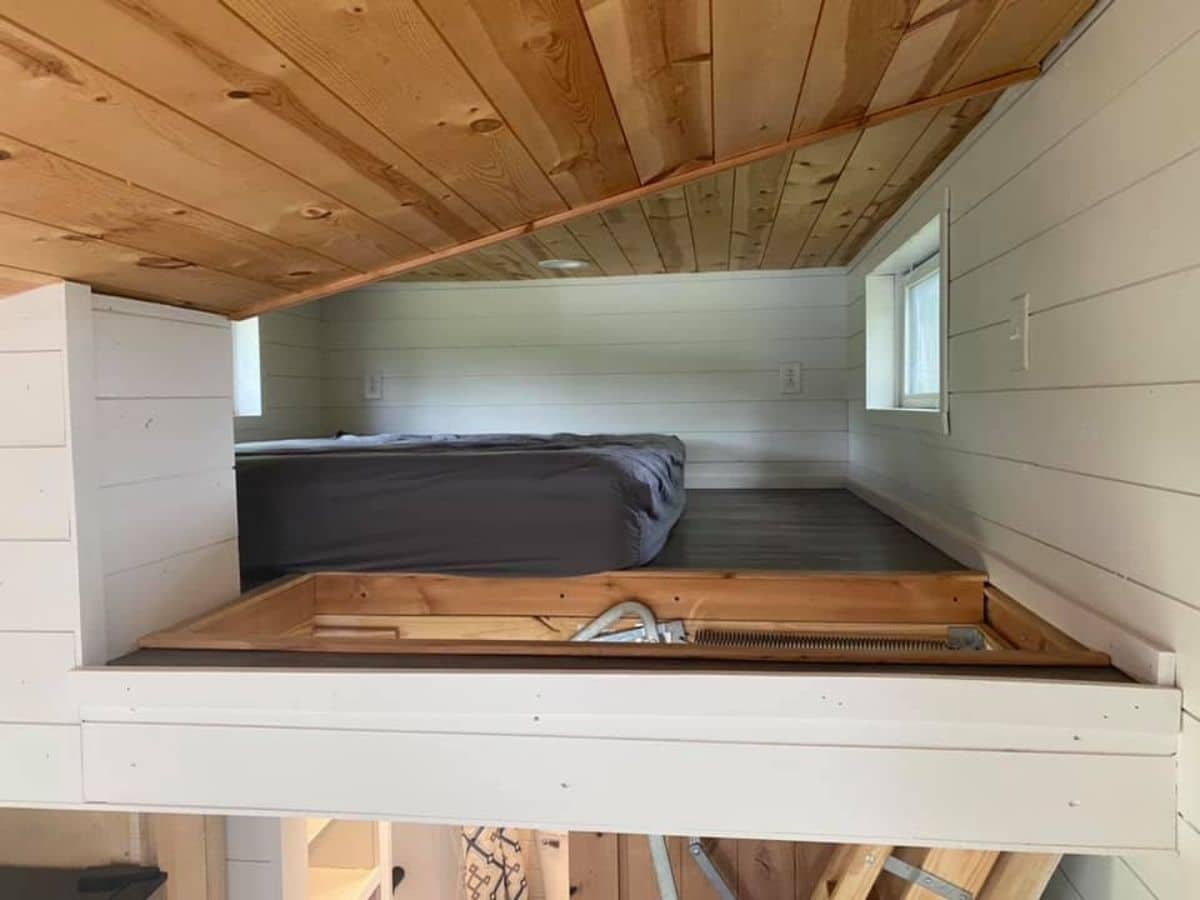 Loft space showing bed under angled roof
