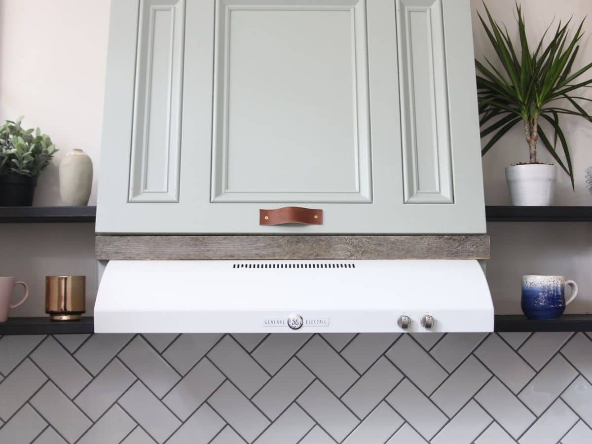 Gray cabinet above vent hood