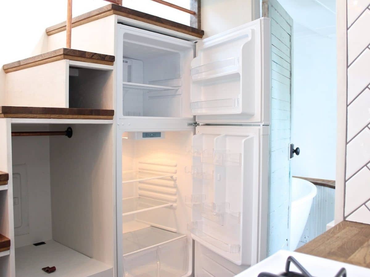 Open refrigerator below loft steps