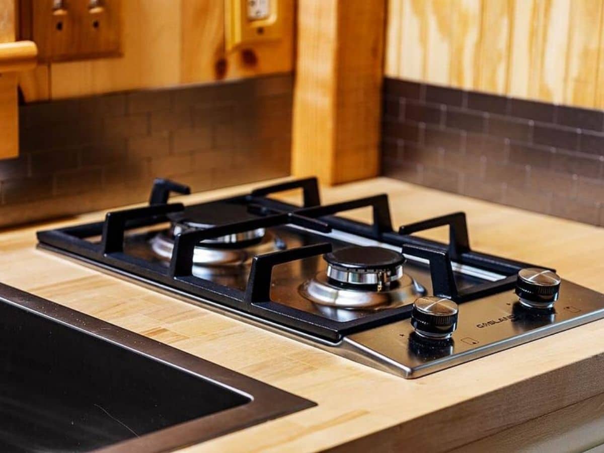 Two burner gas stove in butcher block counter