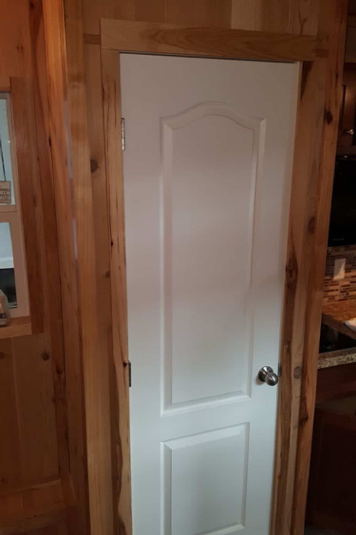 White door in wood frame