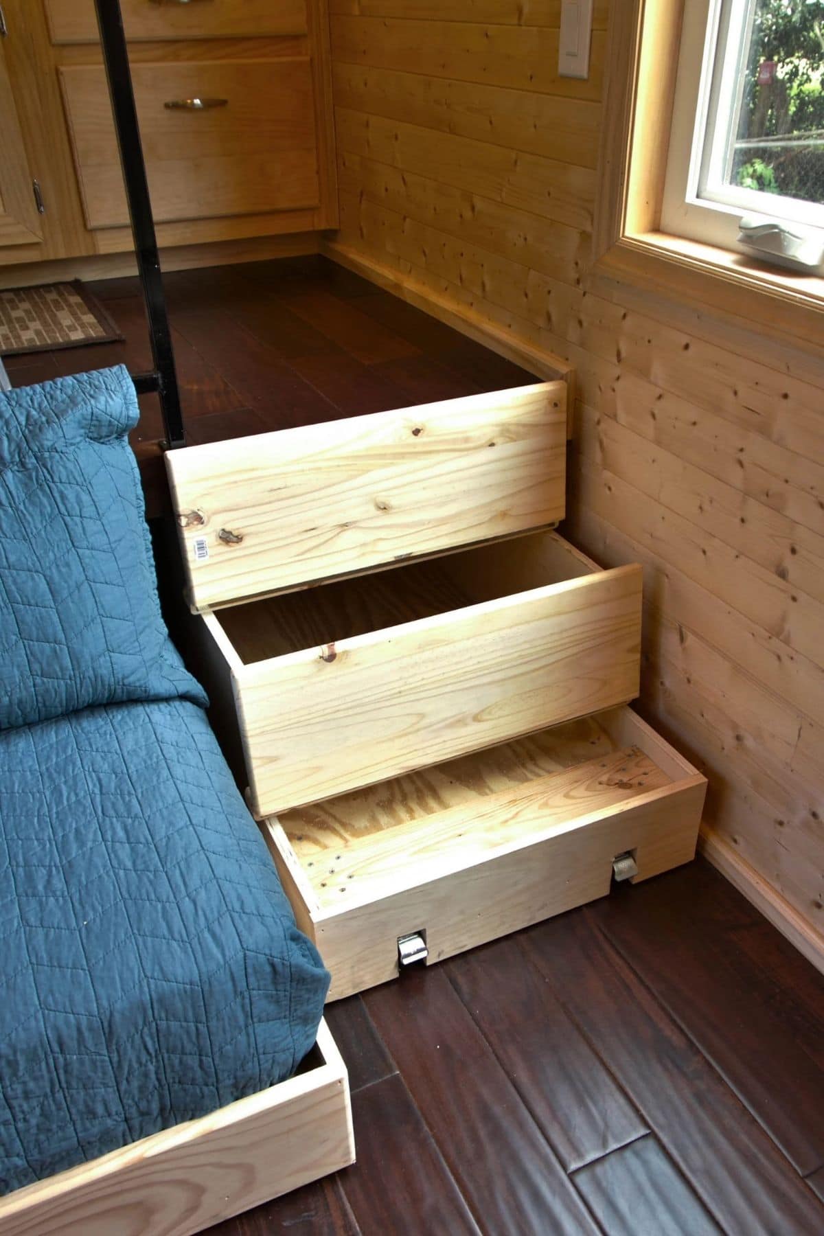 Drawers open on stairs by sofa