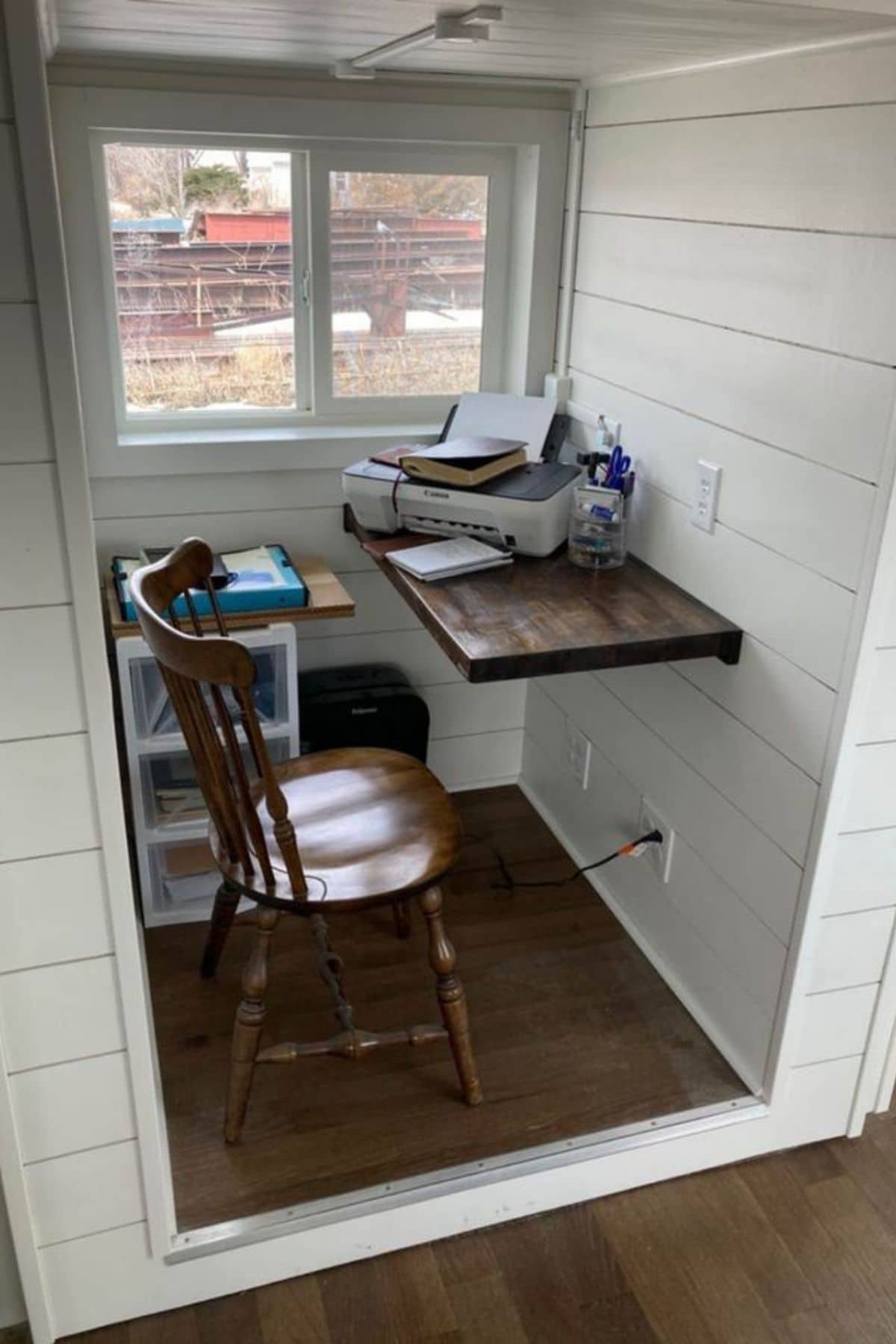Slide out nook with drop down table desk against wall