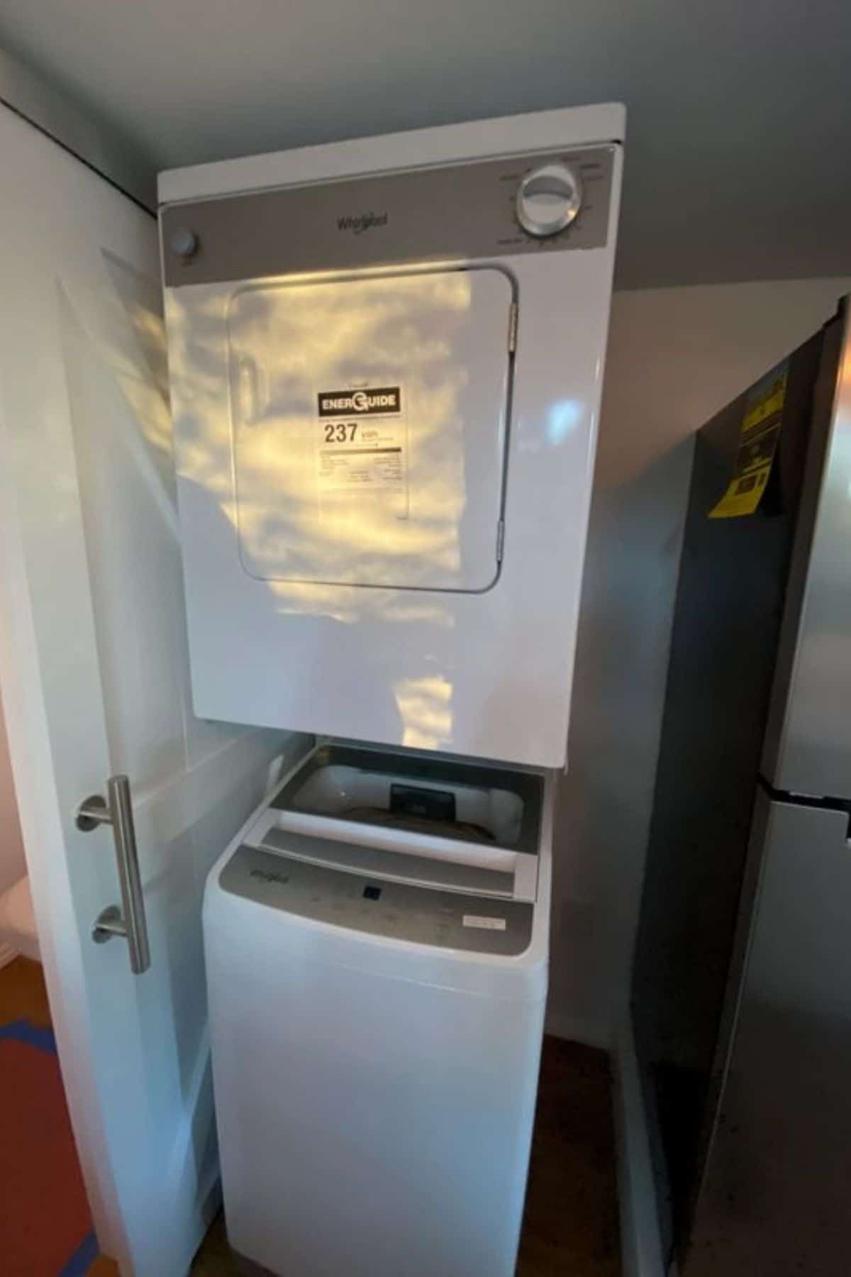 stacking washer and dryer next to refrigerator