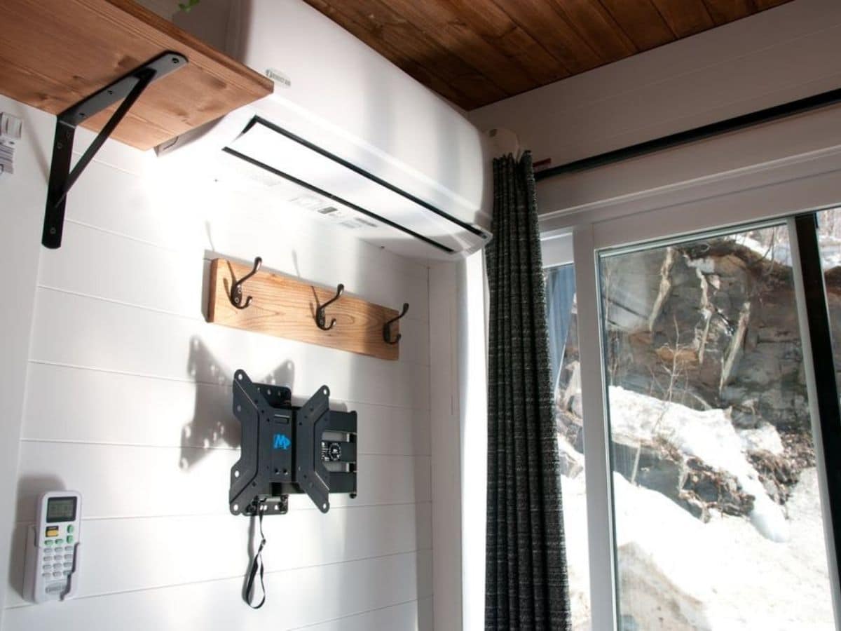 wooden hook and television mount by sliding glass doors