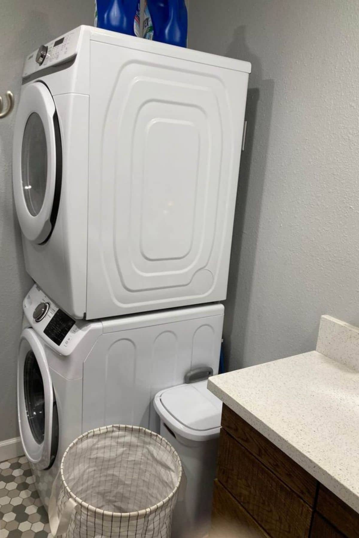 Stackingh washer and dryer next to sink
