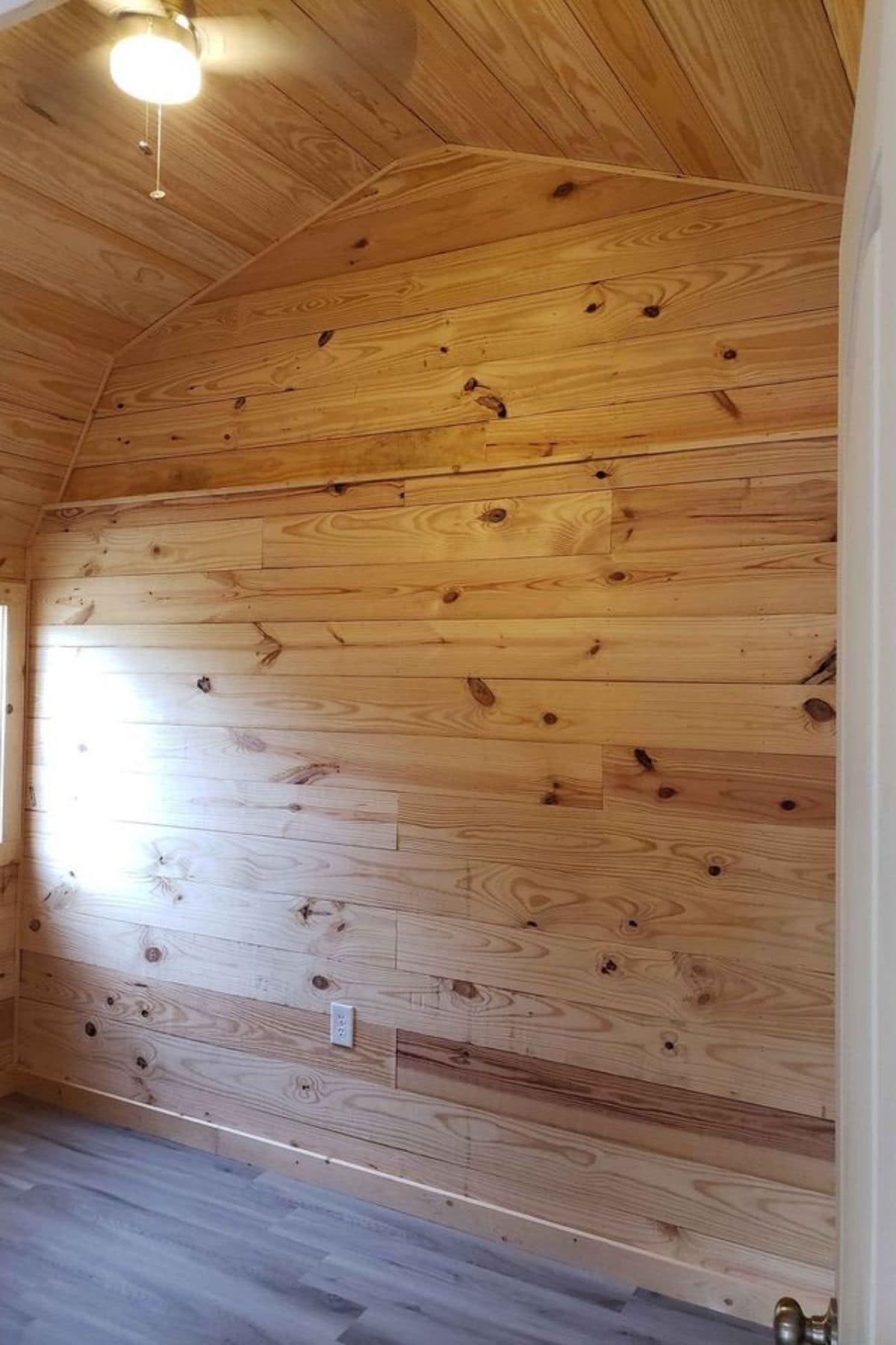 light wood wall inside bedroom
