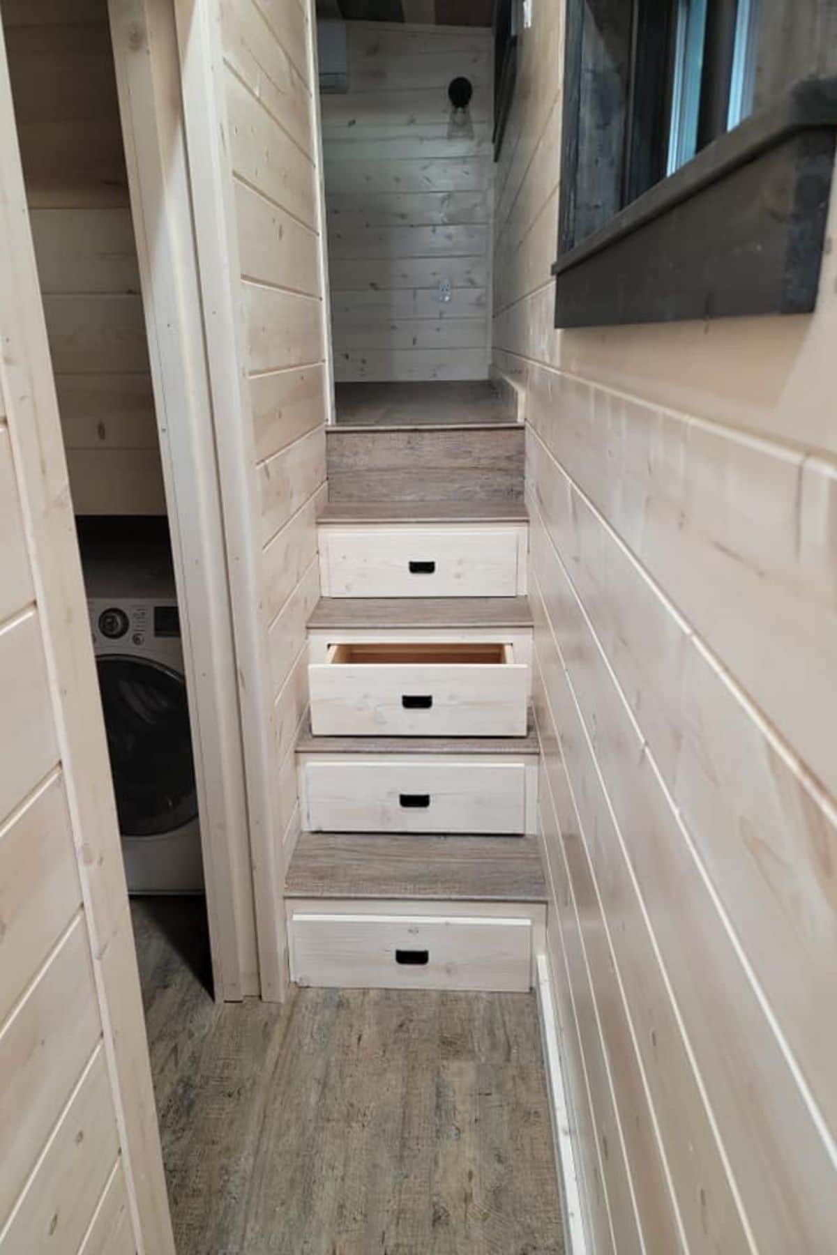 stairs to loft bedroom with drawers beneath stairs