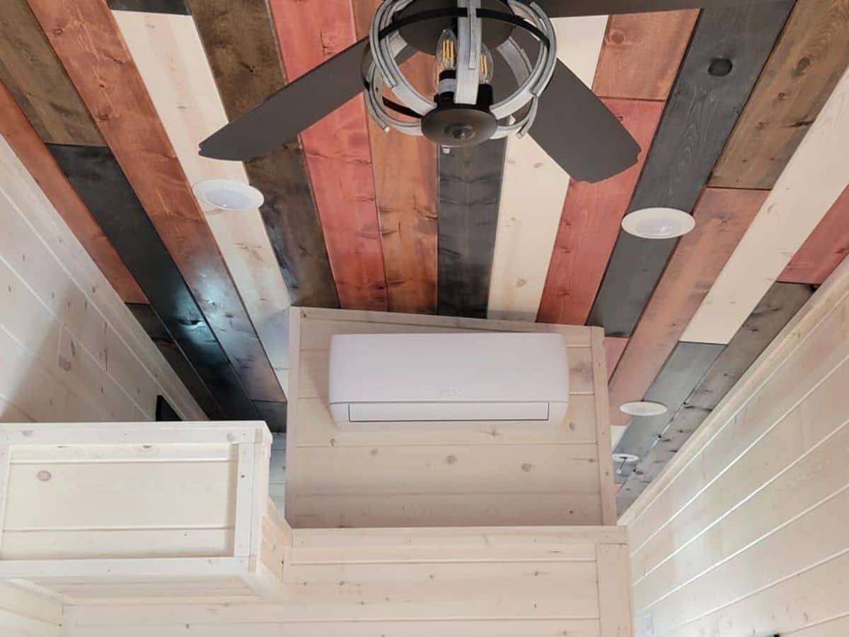 reclaimed wood ceiling with fan in center