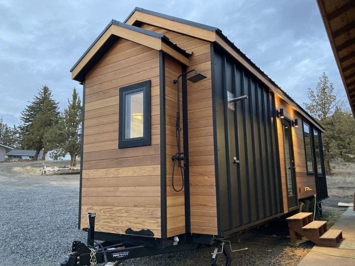 wood tiny house with black accents