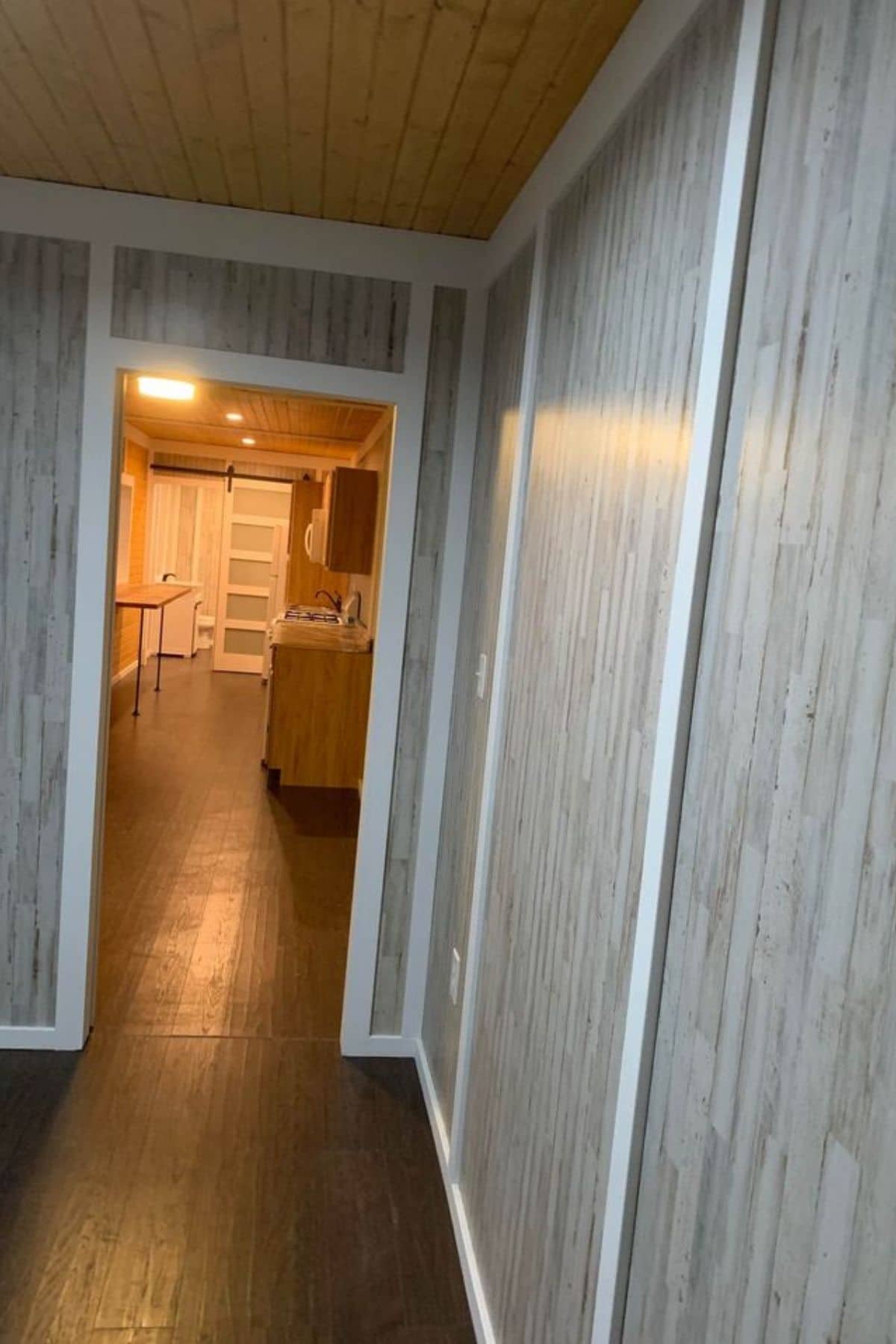 view out into tiny home from bathroom