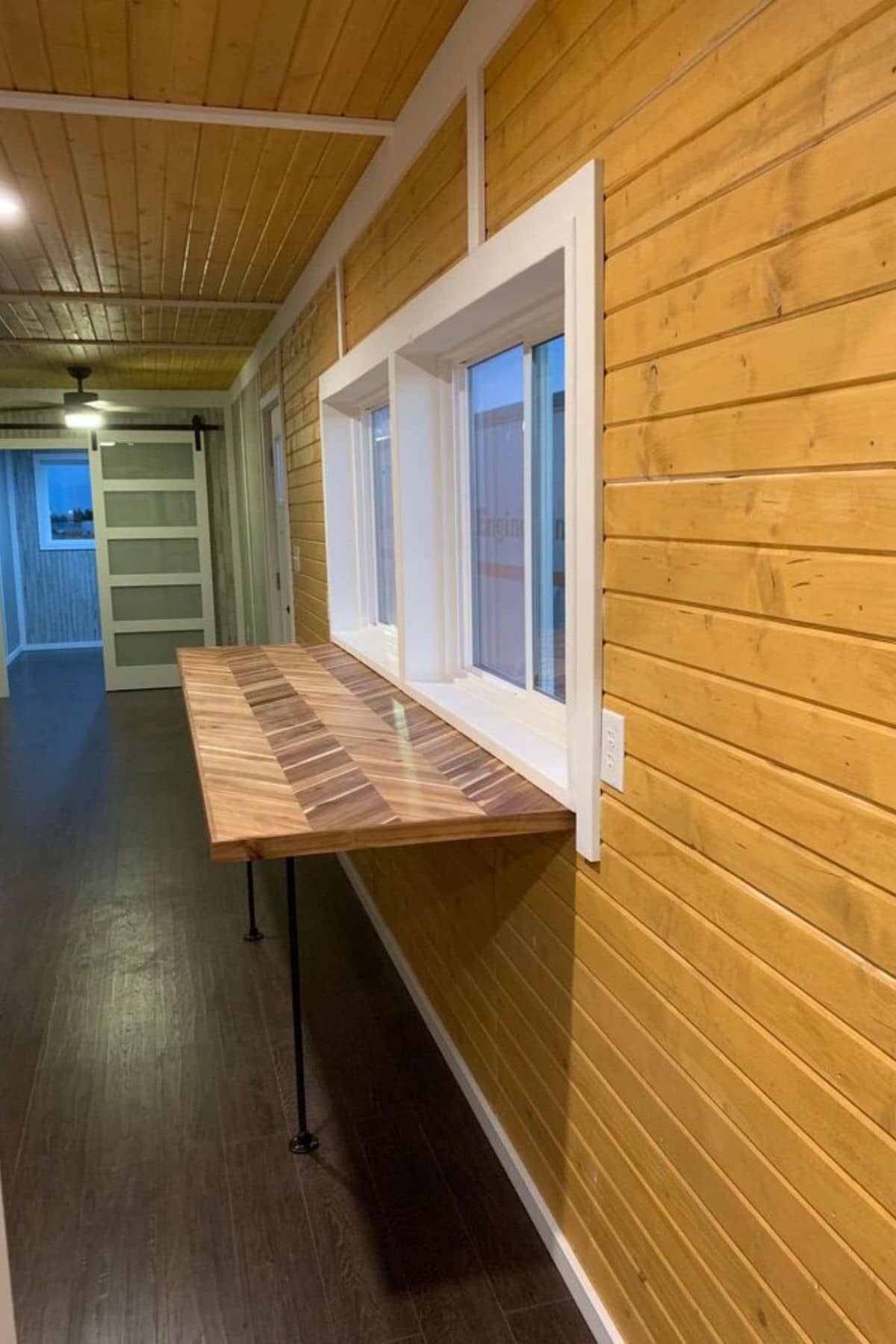 wood shelf underneath window with white trim
