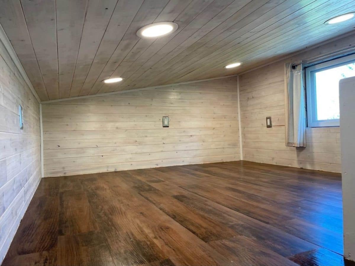 wood floor with cream texture walls in loft