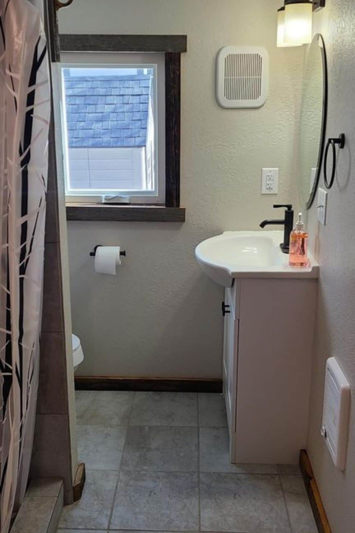white vanity against bathroom wall