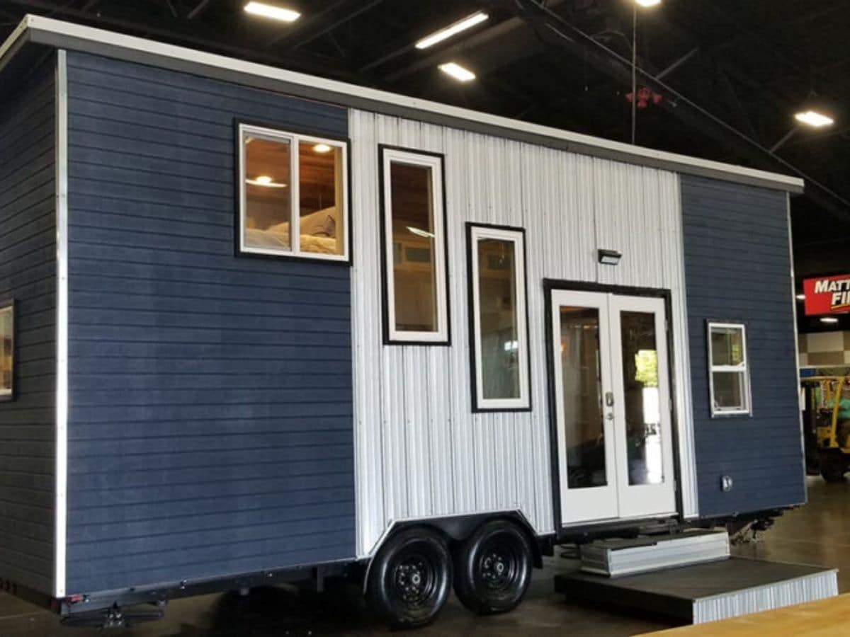 tiny home with blue and white siding