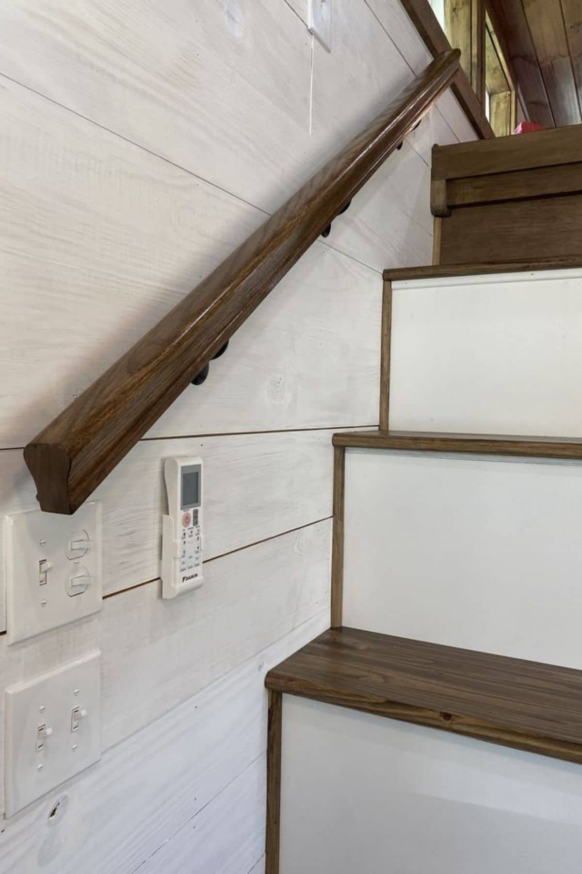 wood railing onw all by stairs to loft