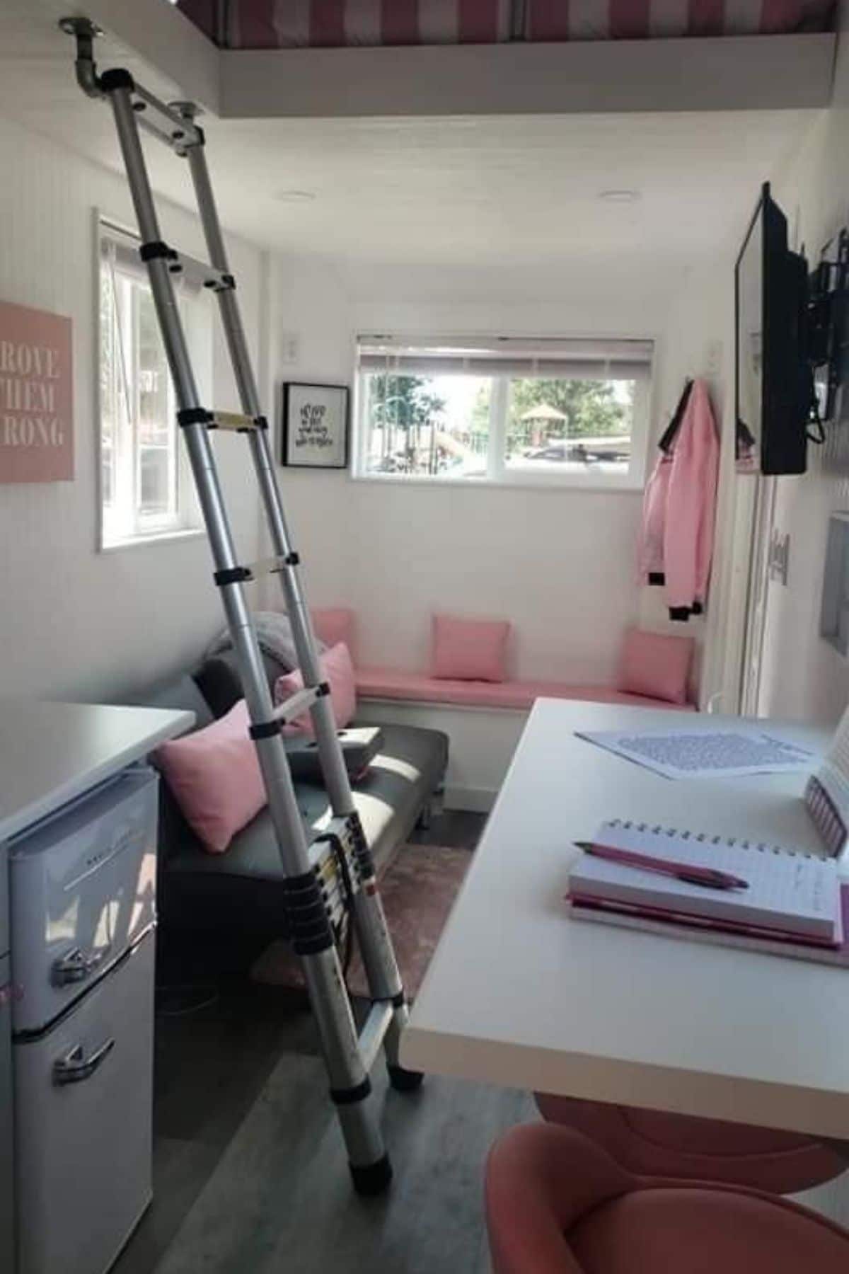 ladder to loft between sofa and counter