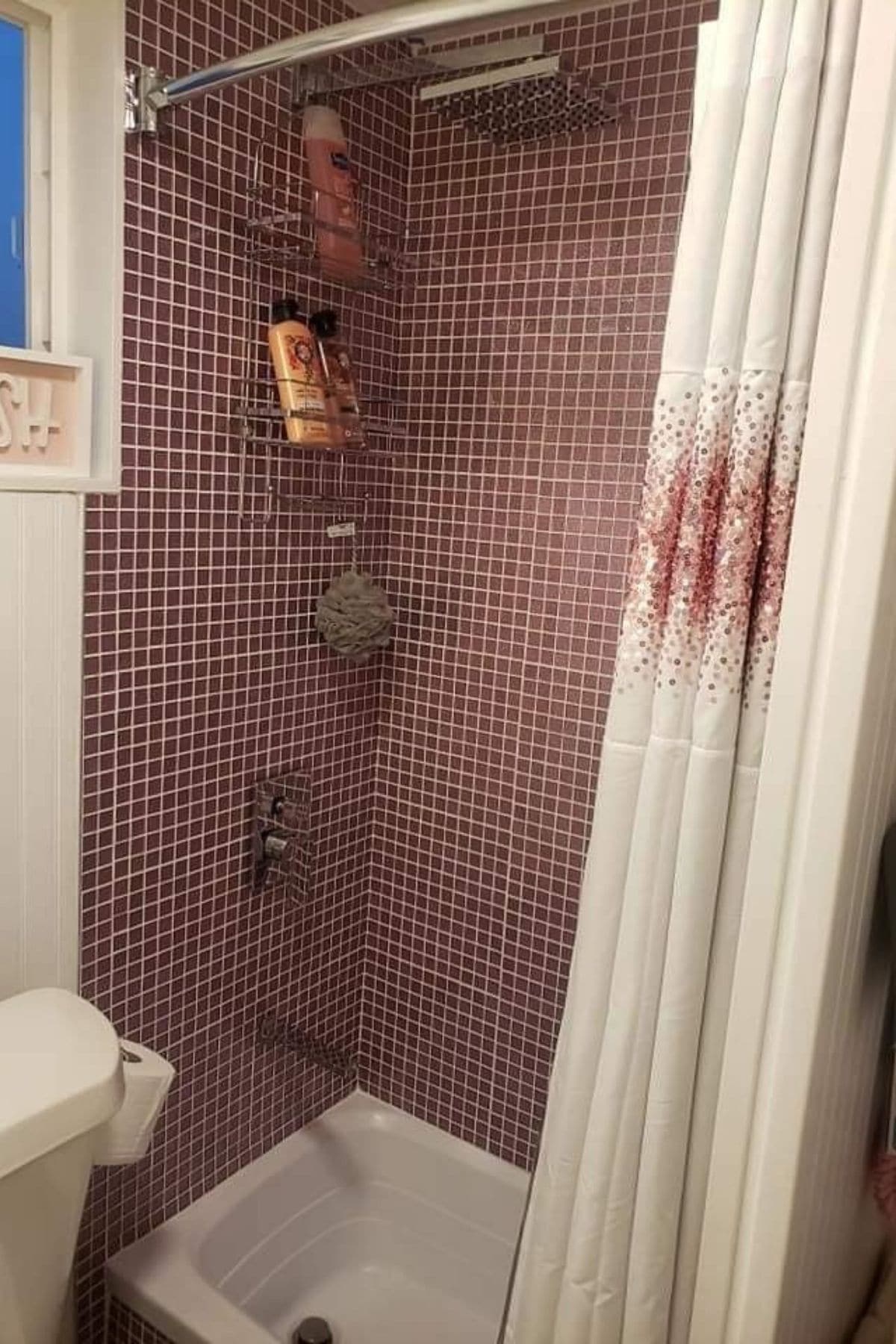pink and white tile in shower with white and pink shower curtain