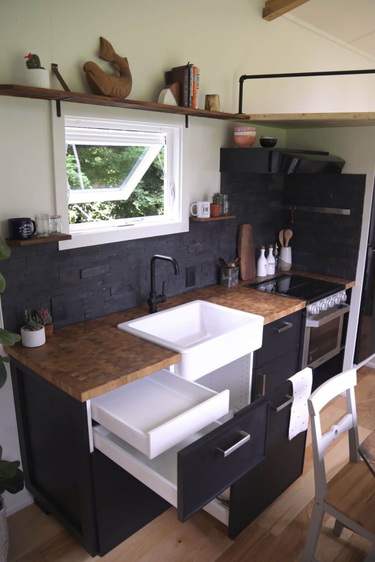drawers open in tiny house kitchen