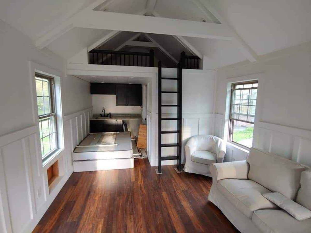 interior of tiny house with wood floor and white walls