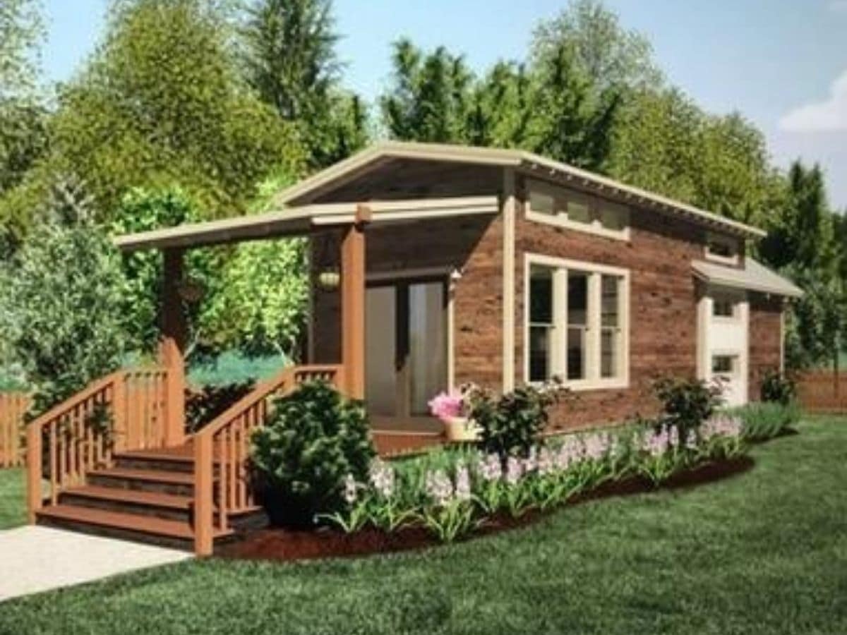 wood tiny home on grass lot