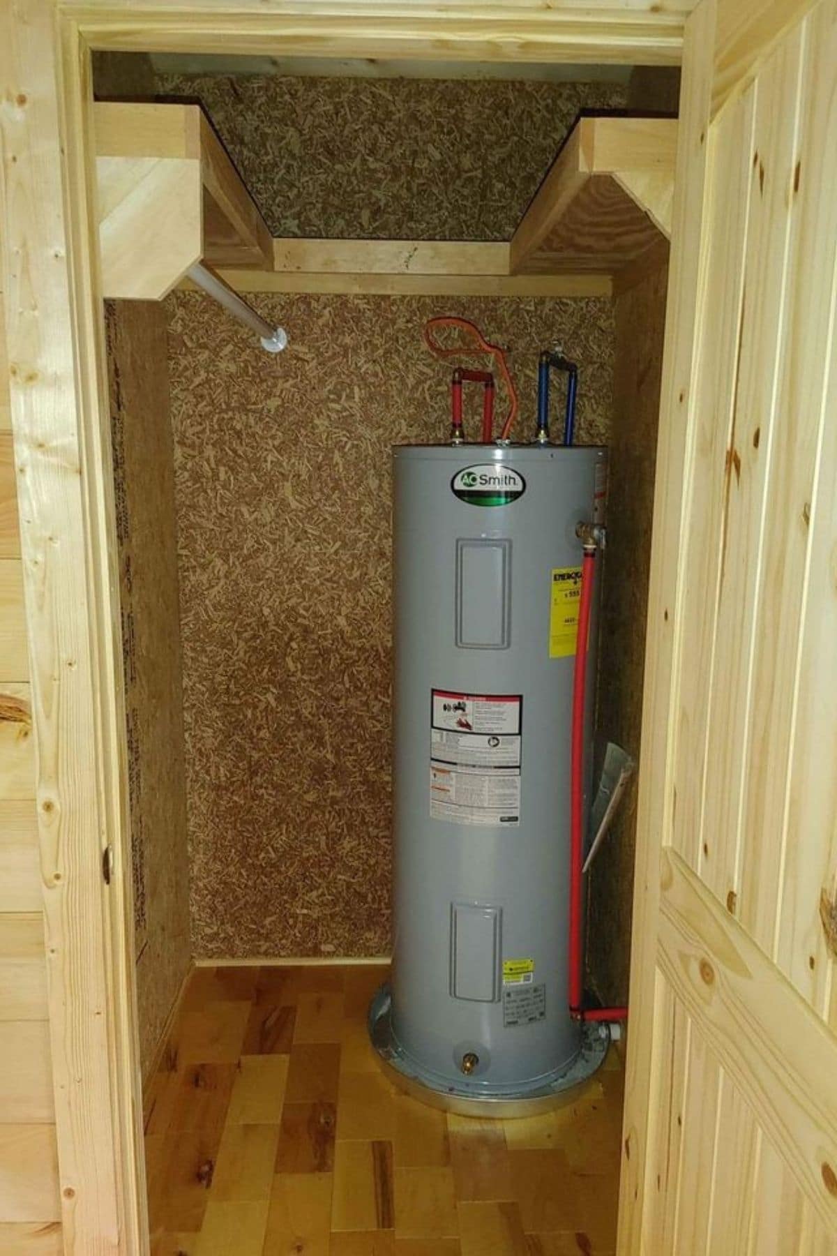 closet with hot water tank in corner