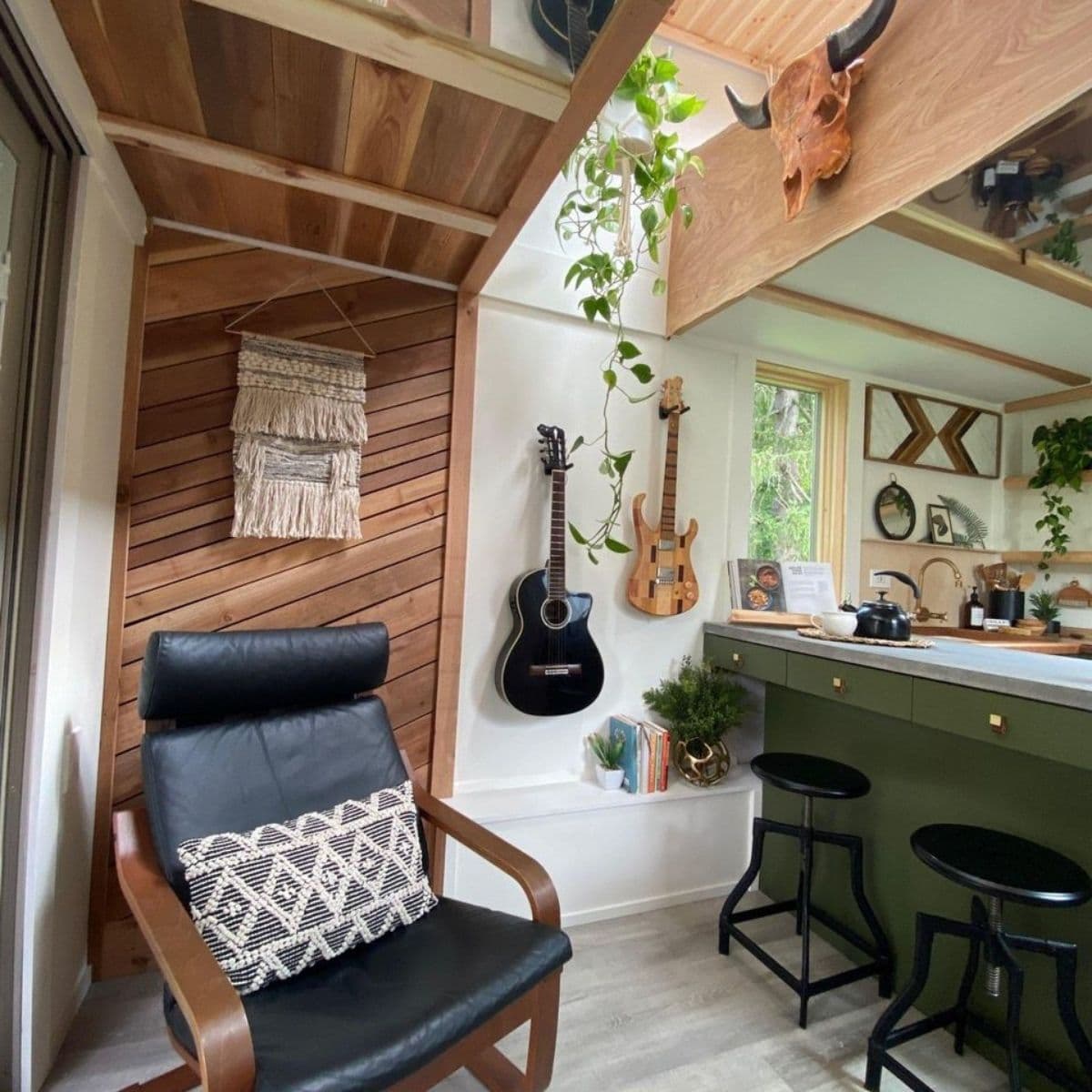 gray chair against wood wall in tiny home