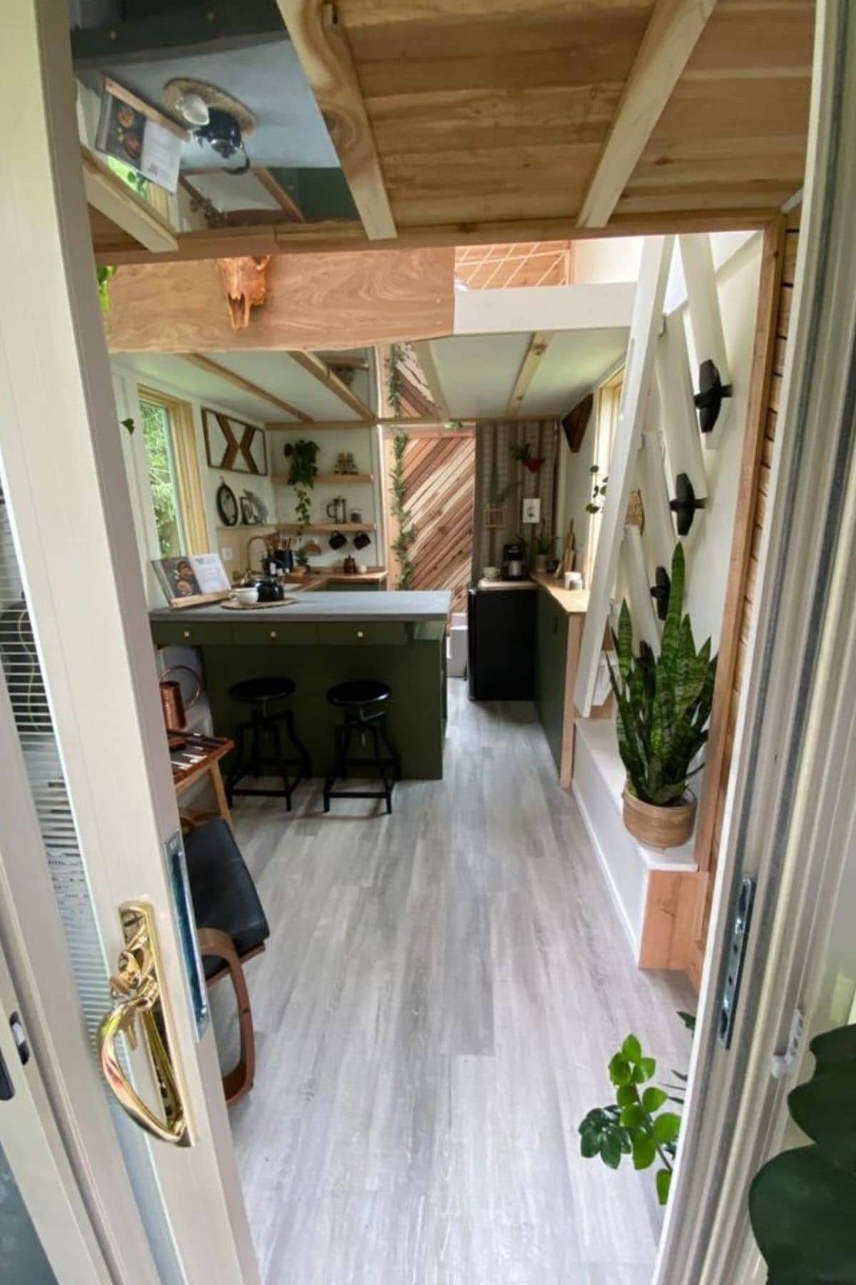 view into tiny home with kitchen bar in middle