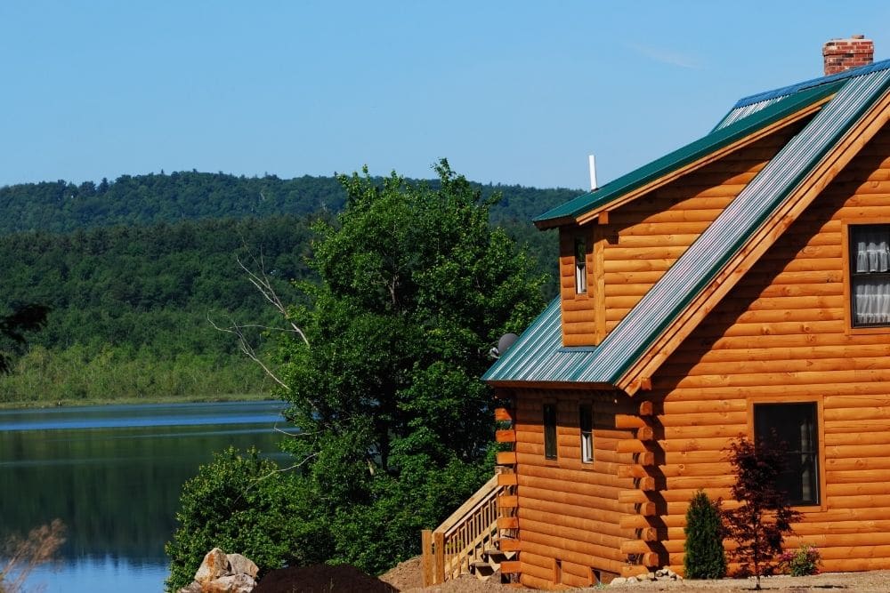 Amish Log Cabin beside a river