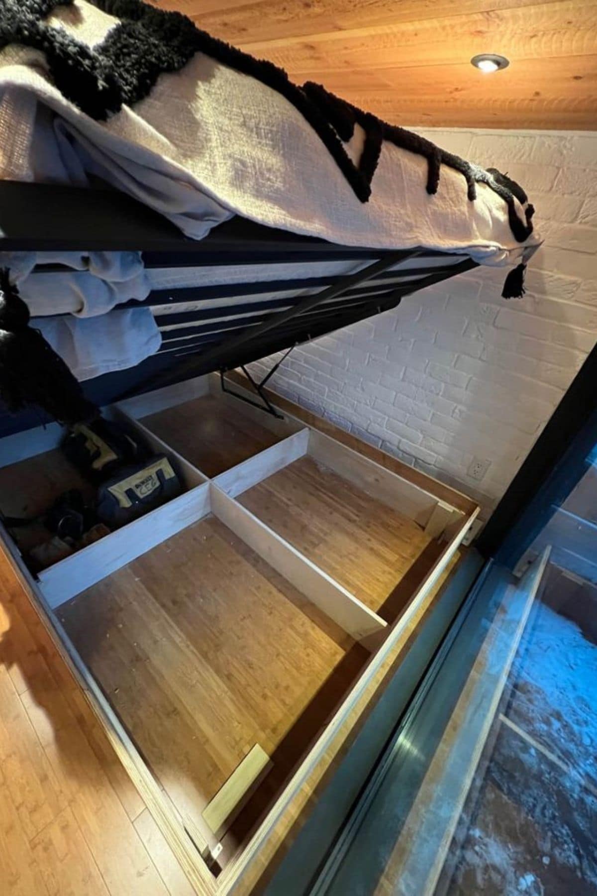 open storage beneath bed in loft