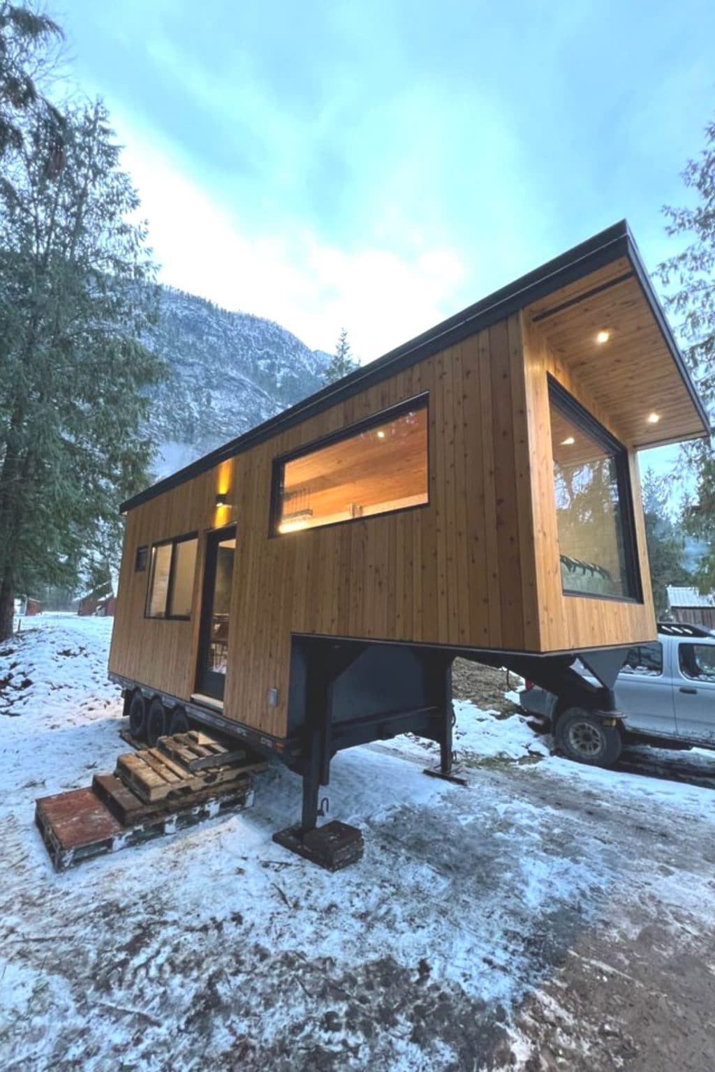 Image showcasing 26' Off Grid Luxury Tiny Home on Wheels with Solar Panels - Tiny Houses