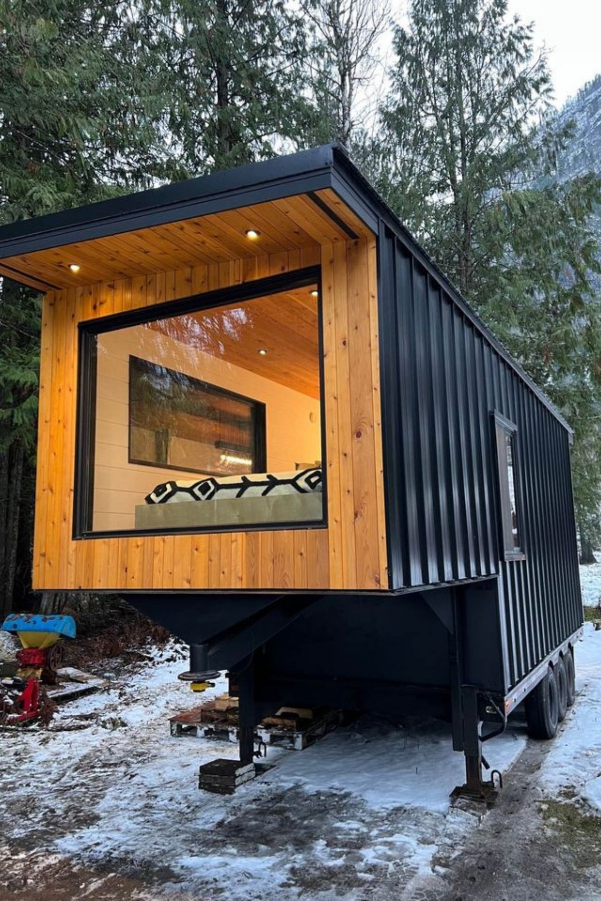 end of gooseneck tiny home with picture window