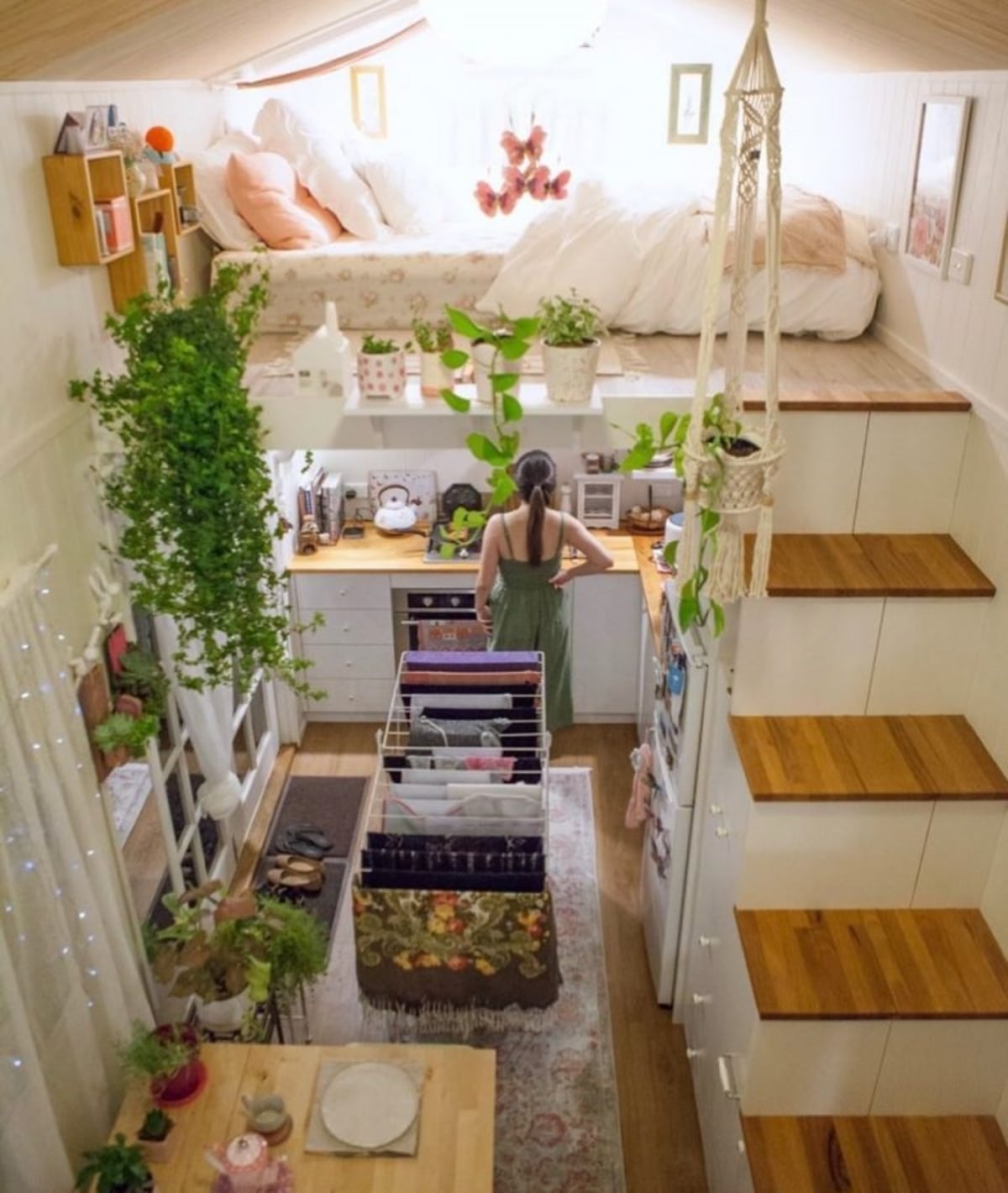 Woman in the kitchen in a loft style tiny house