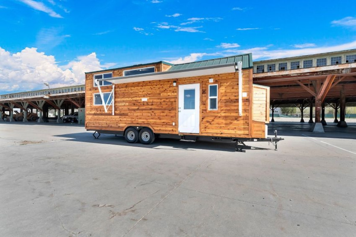 Tiny house with wheels and wooden design