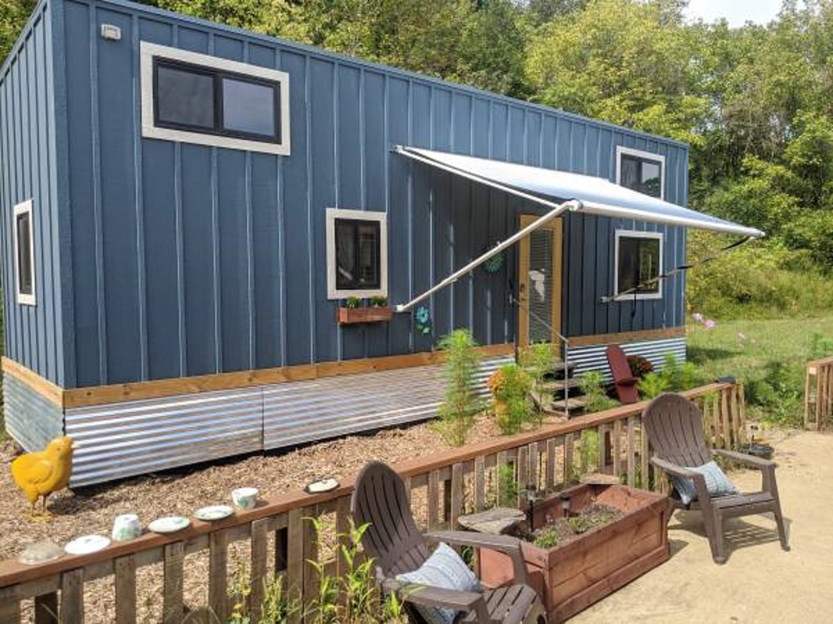 Blue repurposed Container ban tiny house