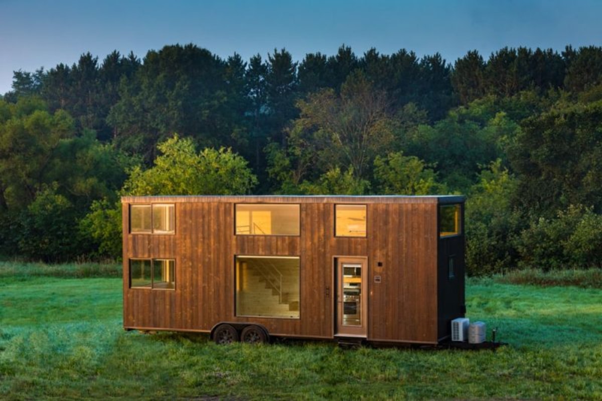 Rectangular Tiny house with wheels on the grass