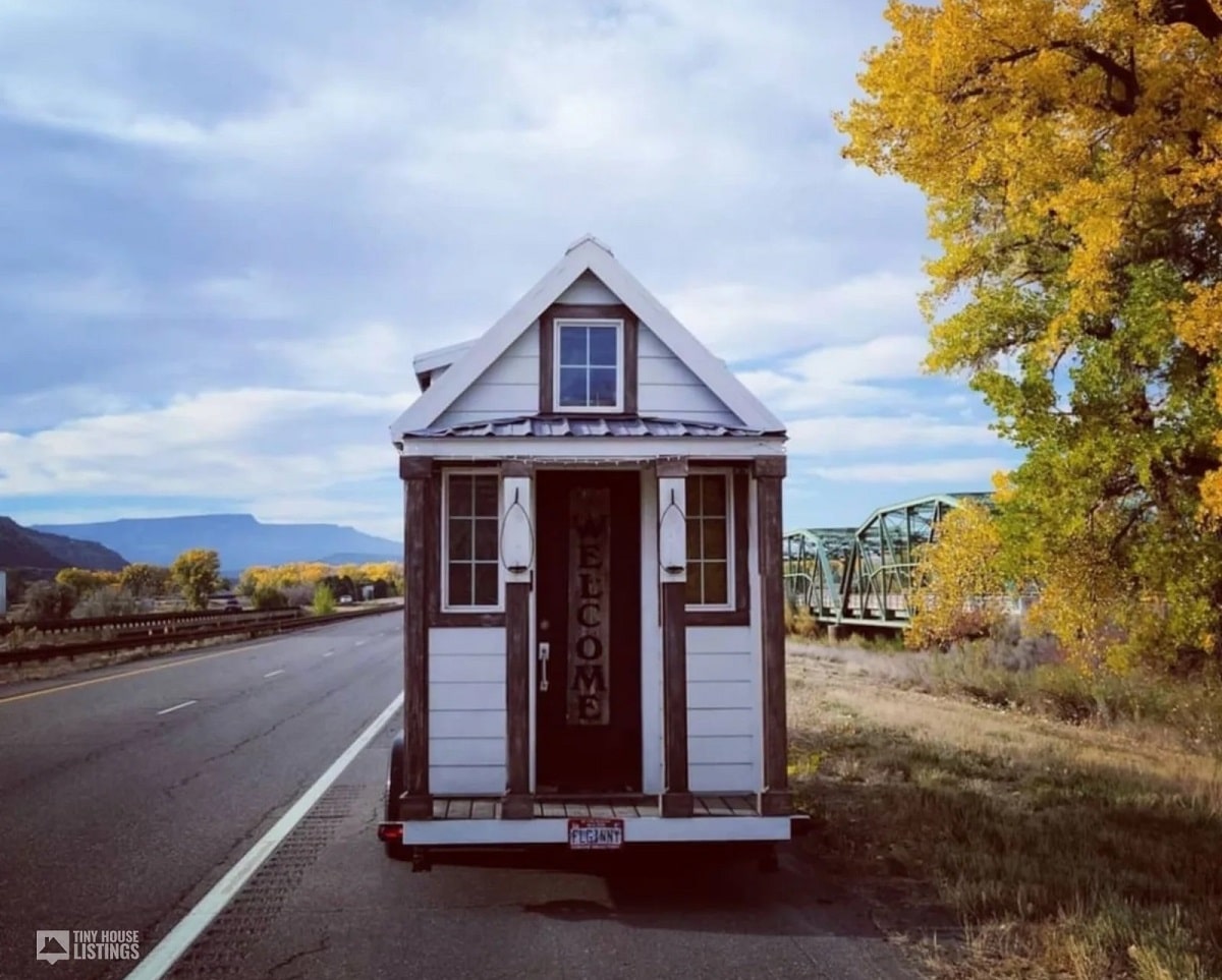 A tiny house with wheels on the road