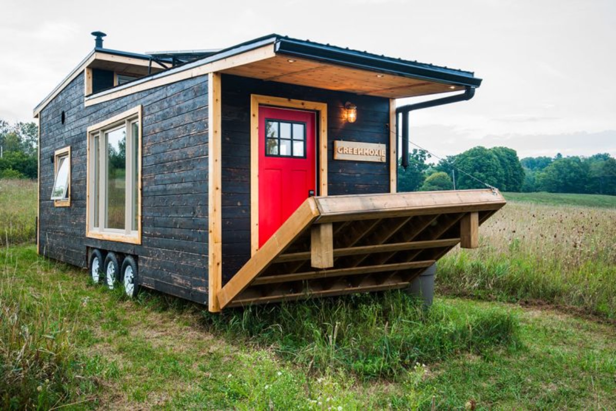 Tiny house with wheels and red door