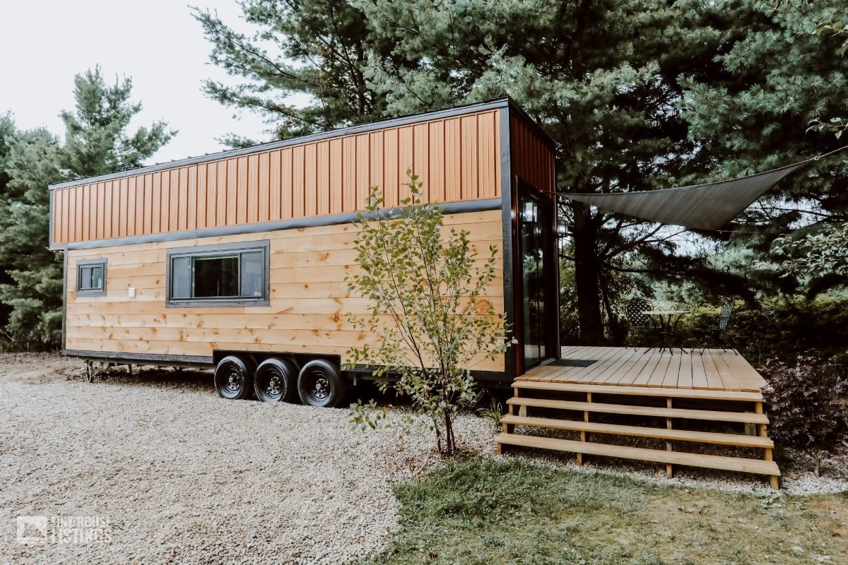 Container tiny home on wheels with patio