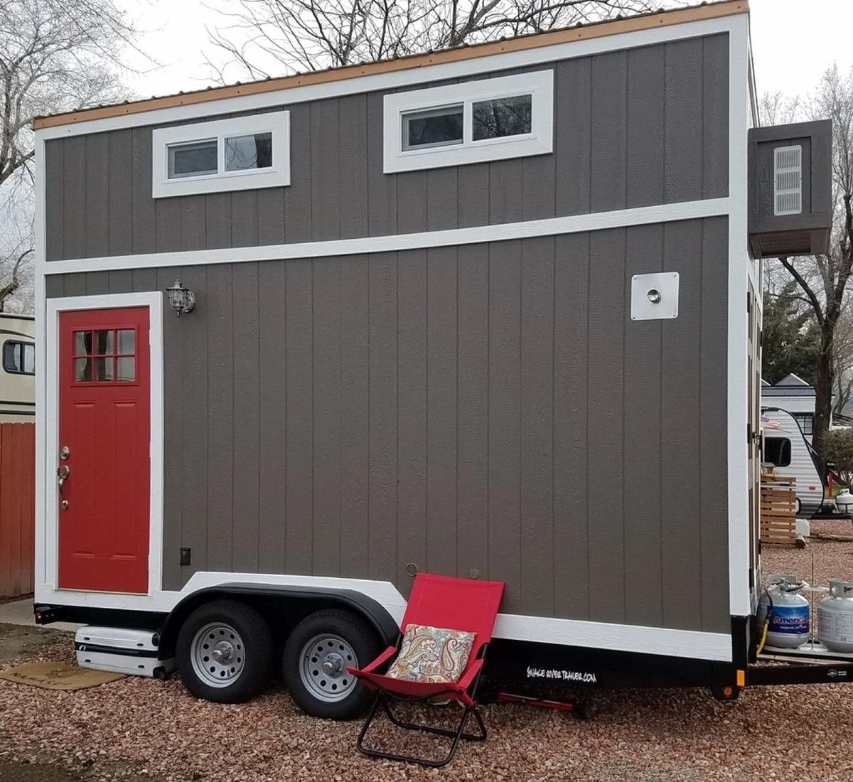 grey colored tiny house on wheels