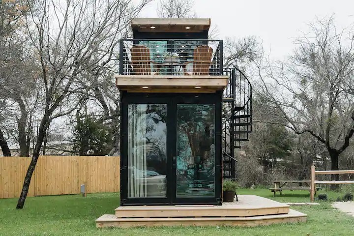 Small Container House with Glass Door and Spiral Staircase on the Side