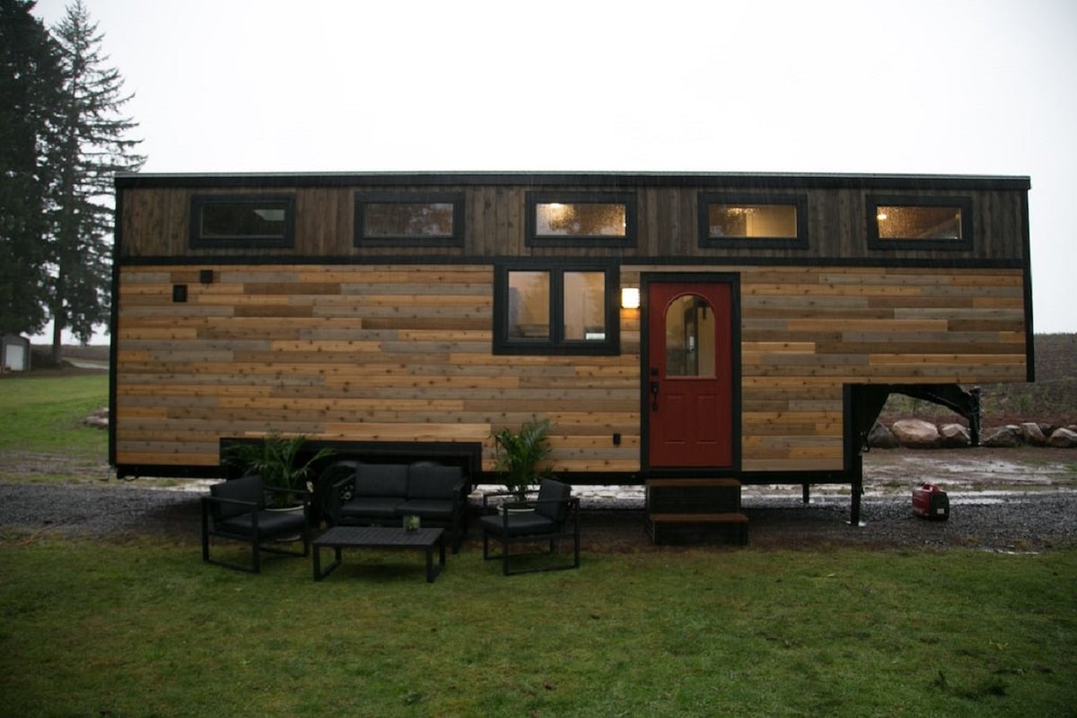 Side view of rustic styled cabin tiny house