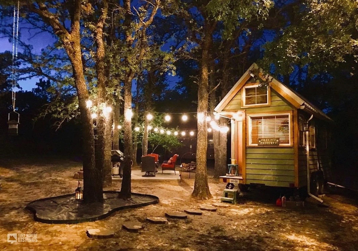 Tiny home with garden lights at night