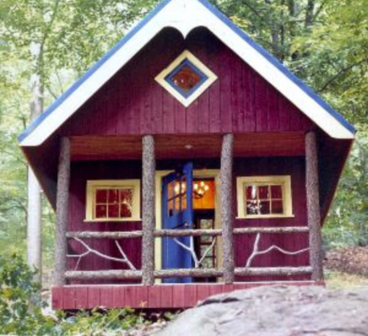 Tiny red writer's cabin in the woods