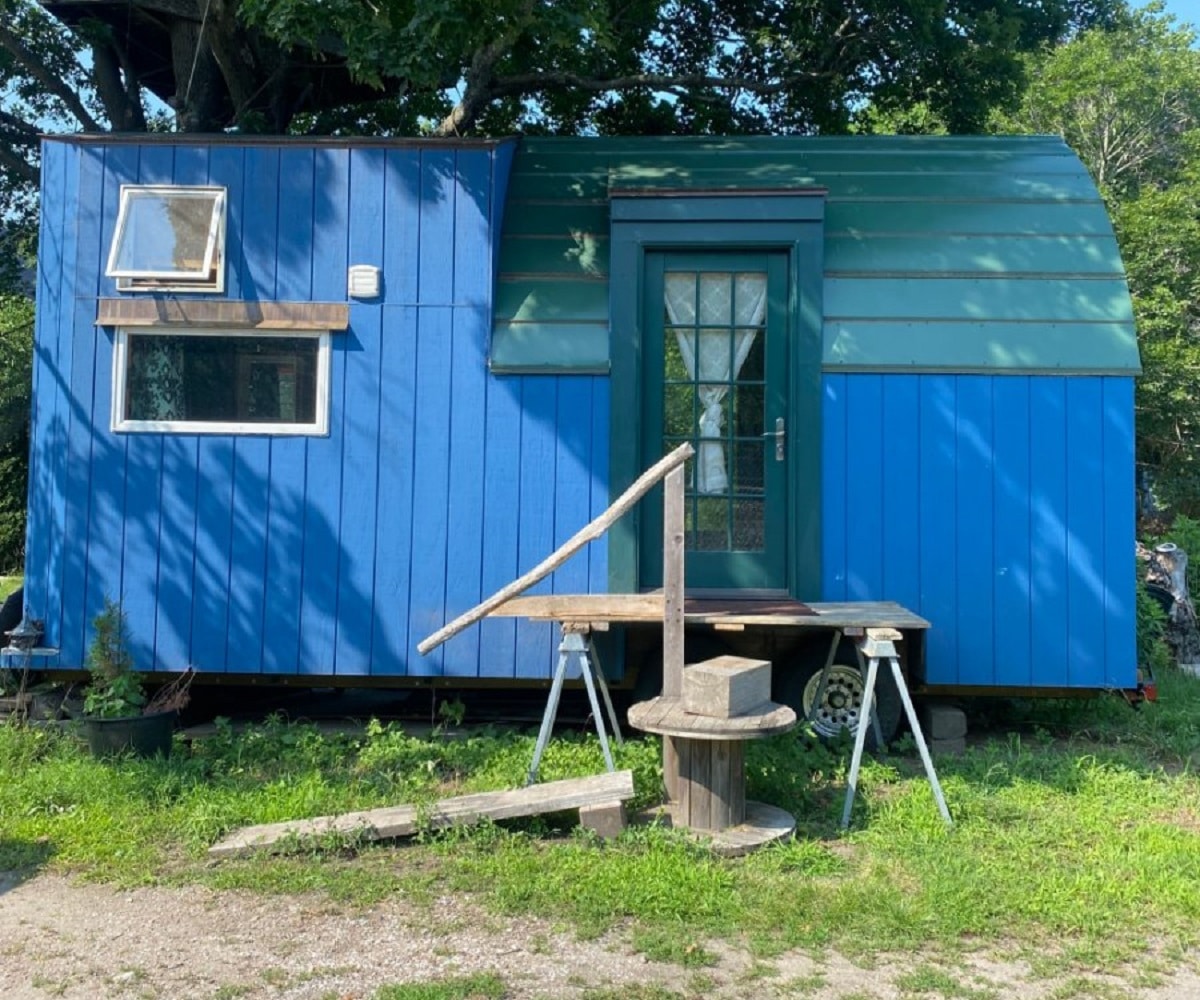 Blue custom built trailer tiny home