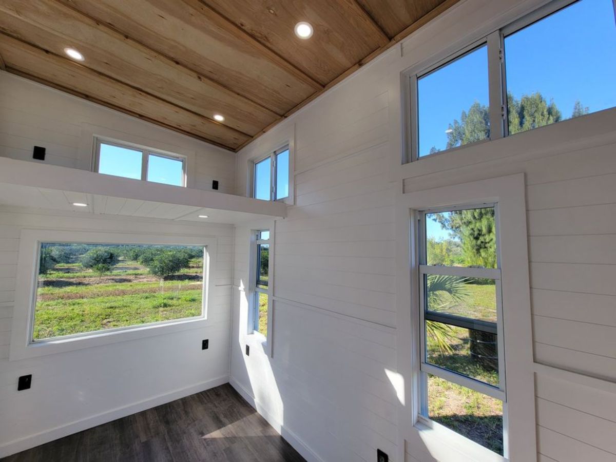 white walls with large open windows in tiny home