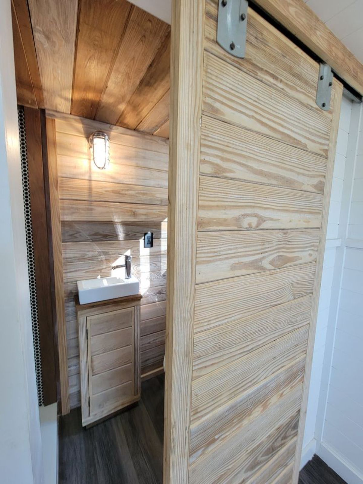 view into bathroom through barn door closure