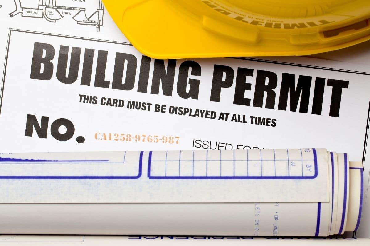 Building permint card with yellow helmet
